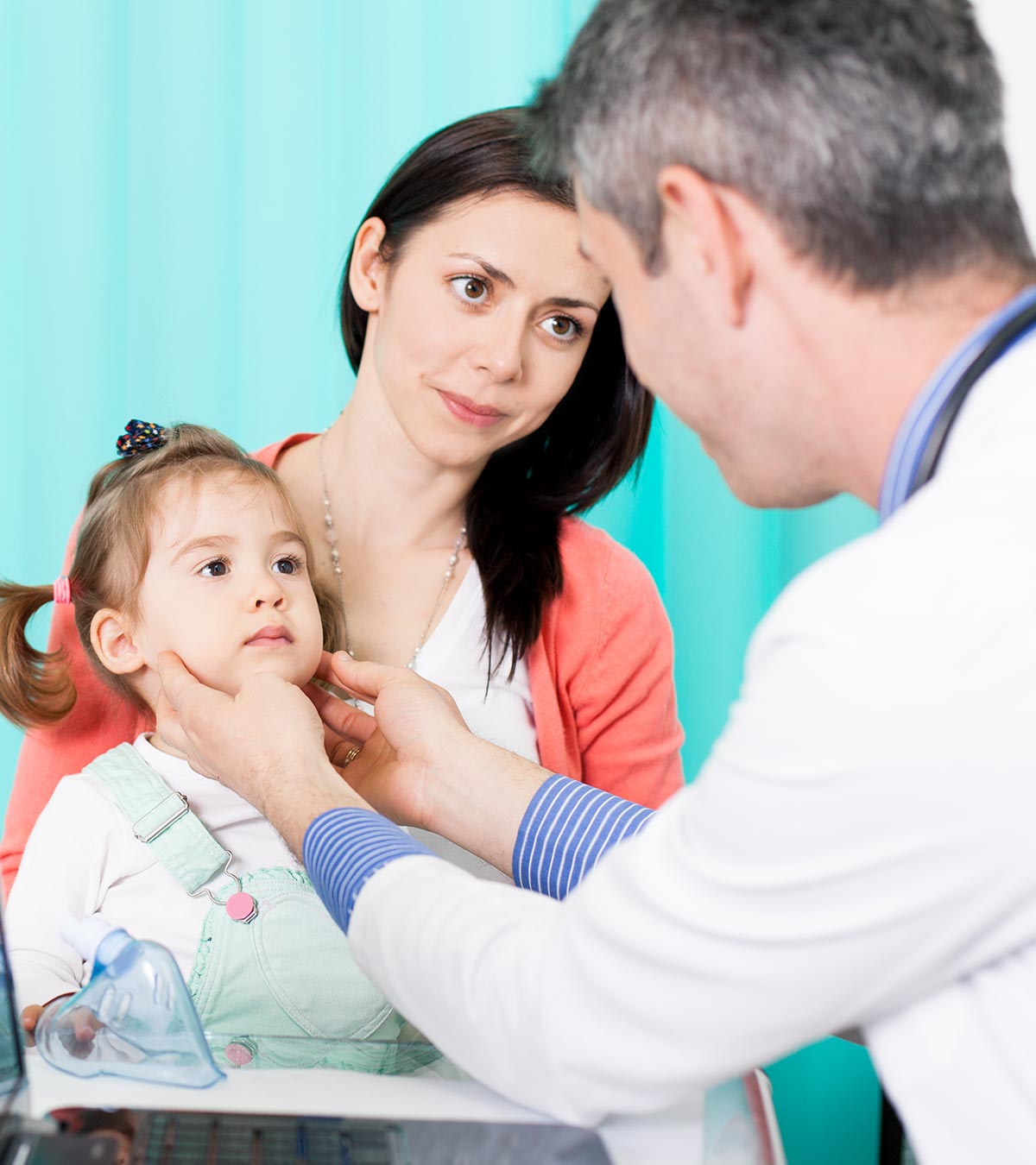 A doctor checking a child