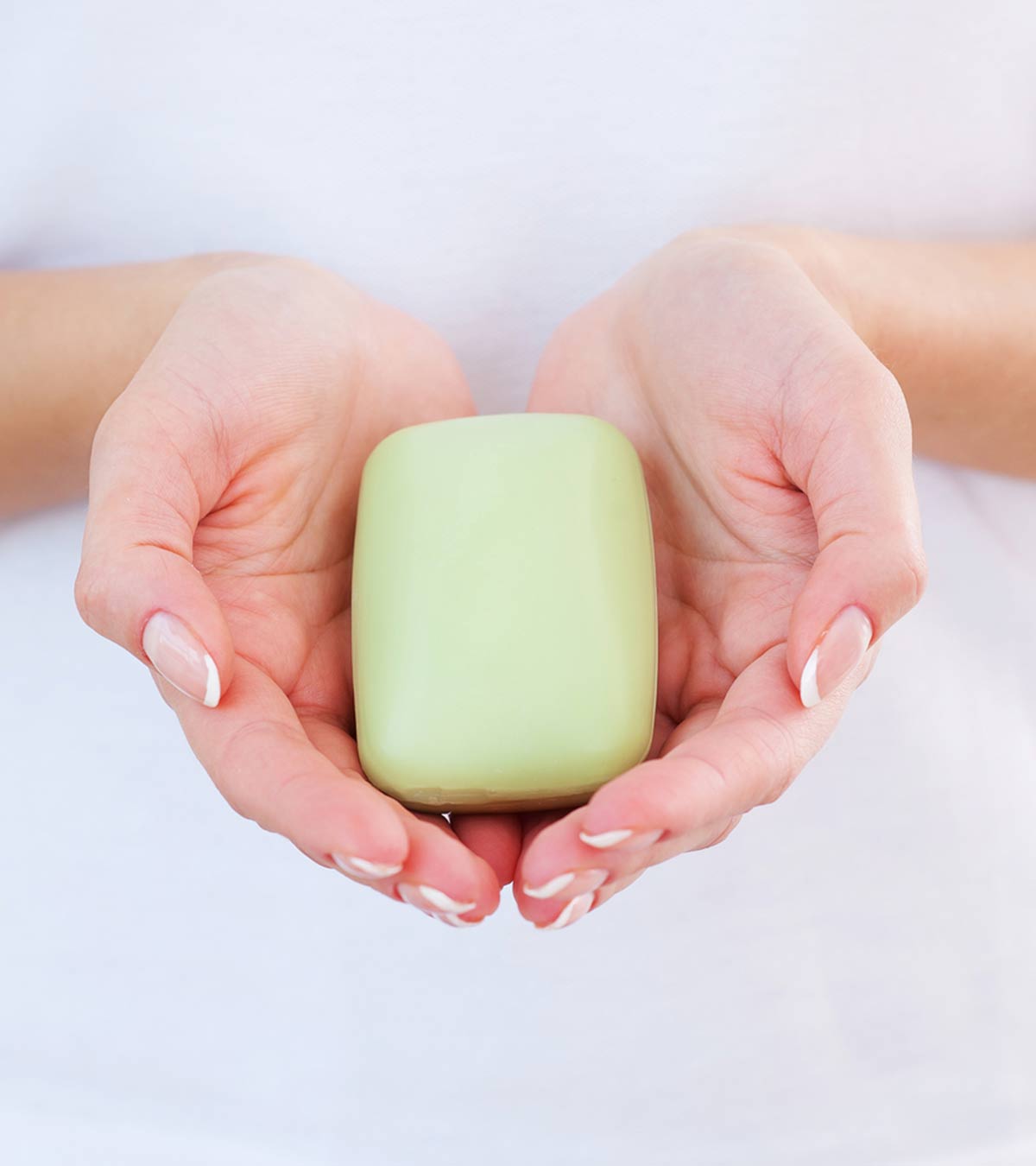 A girl holds a homemade soap