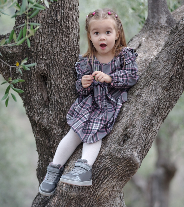 A baby girl sitting 