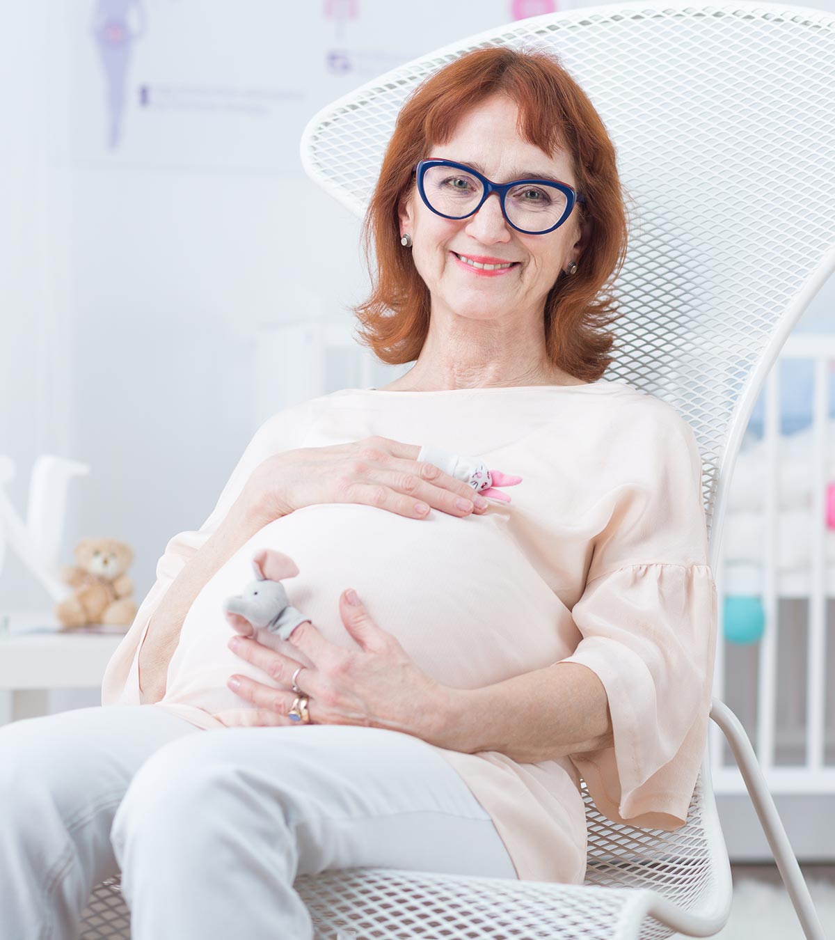 A 50 Years Old Pregnant Woman Sitting On Chair