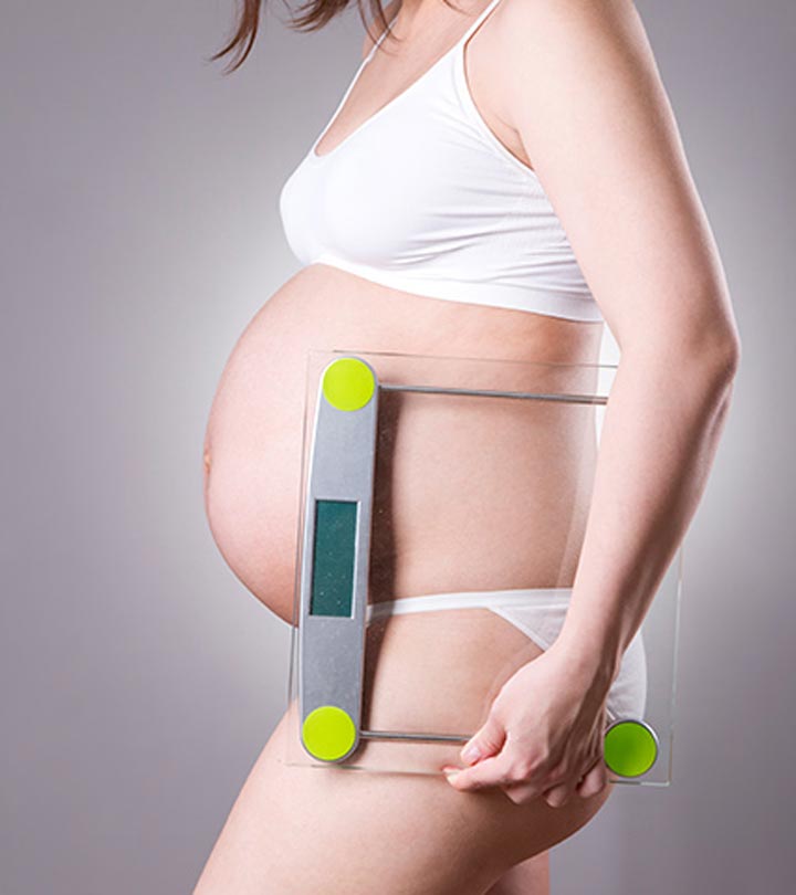 A Pregnant Woman Measuring Weight