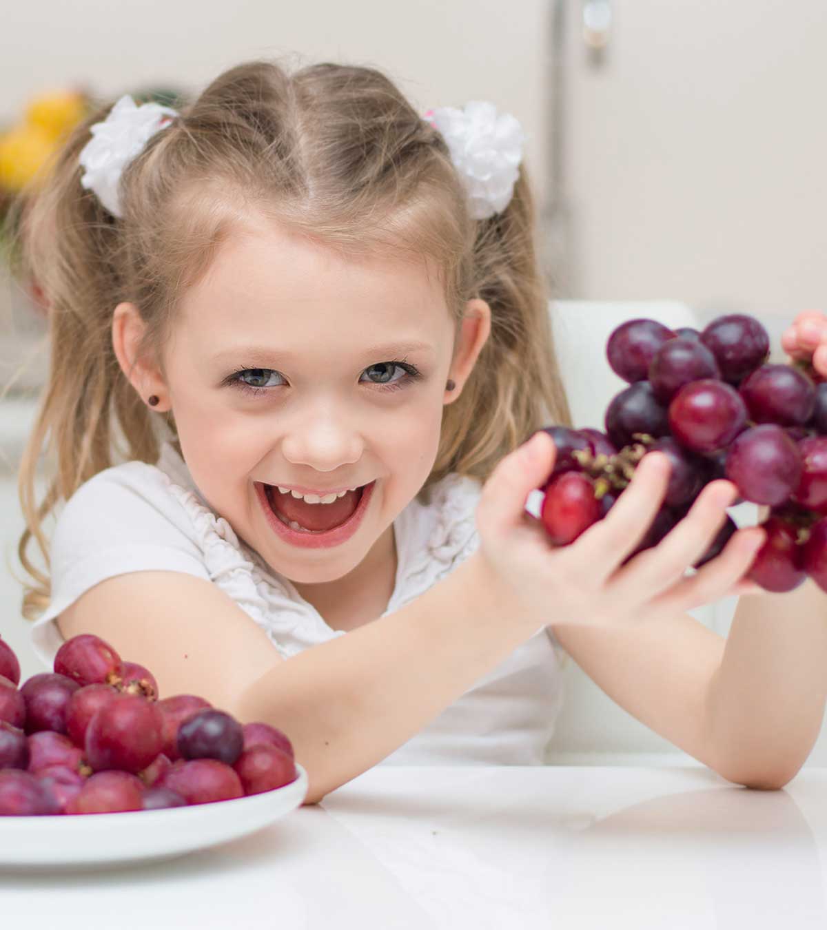 Kid Having Grapes